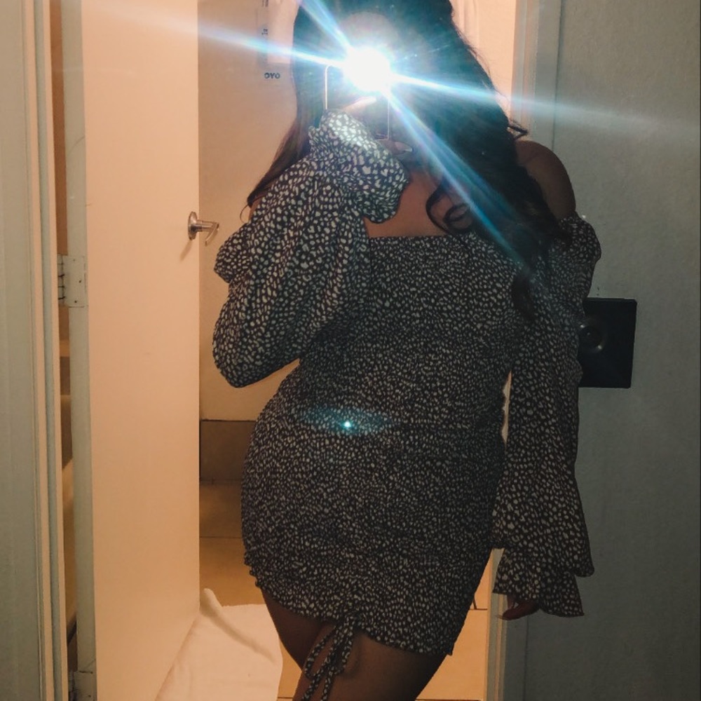 Off the shoulder brown and white dress.